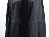 black cape with fringes on mannequin dummy on white background
