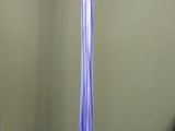 a tall glass vase that is sitting on a table