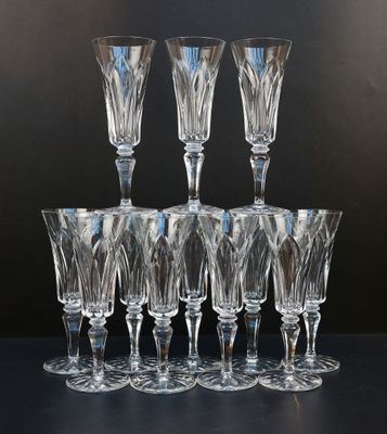 six clear wine glasses sitting on top of each other on a table
