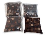 two pillows and a pillow are wrapped in plastic bags on a white surface