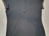 the polo shirt is grey and has a white stripe on the collar