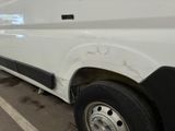 a white van that is parked in a parking lot