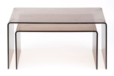 a clear glass table with two black legs and a clear top