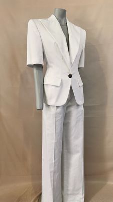 an image of a mannequin dressed in a white suit