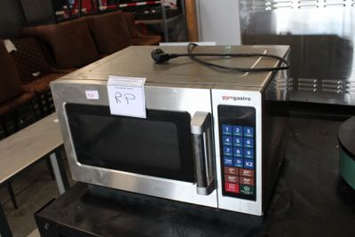 a microwave that is sitting on a table in a room