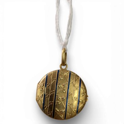 a close up of a gold locke on a white string