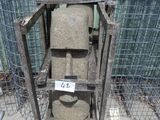 a metal cage that has a toilet in it