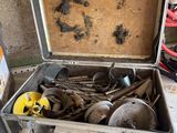 a suitcase with tools in it sitting on a table