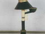 a lamp that has a pipe on it and a lamp shade on it