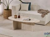 a living room with a white couch and a coffee table