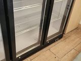 two glass doors on the back of a refrigerator