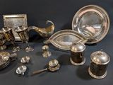 a lot of silver items that are on a table