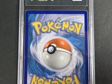 a close up of a pokemon card in a plastic case