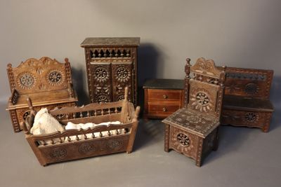 four pieces of furniture that are sitting on a table