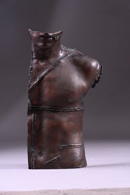 bronze bust of a man with a chain around his neck