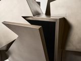 a metal sculpture with a star on top of it