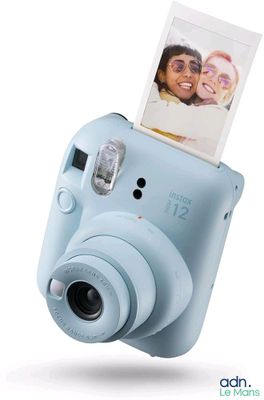 a blue camera with a picture of a man and a woman on it