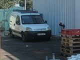 a van that is parked in front of a building