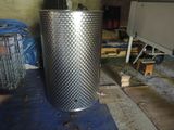 a large metal tank sitting on the floor in a room