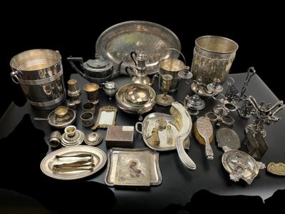 a table with a lot of silver items on it