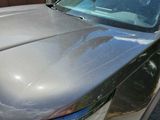 a close up of a car that has been painted silver