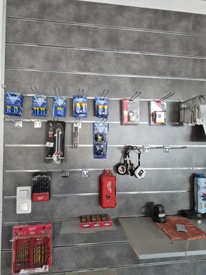 a picture of a work area with tools on the wall