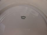 a white plate with a black writing on it