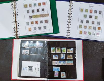 a lot of stamps on the pages of a binder
