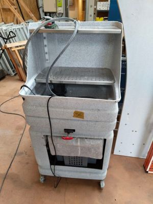 a cooler that is sitting in the middle of the floor