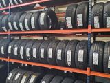 a lot of tires on the shelves in the store