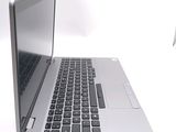 a laptop computer sitting on top of a white table