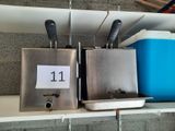 two ice cream dispensers on a shelf next to a blue cooler