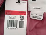the nike jacket is pink and has a white tag on it