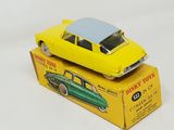a yellow toy car sitting on top of a yellow box