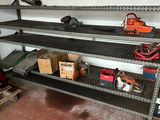 a shelf that has tools on it in a garage