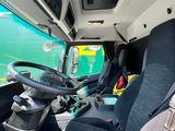 a view of the inside of a bus from the driver ' s seat