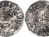 a silver coin with an image of a man on it
