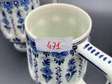 pair of blue and white mugs with a price tag on them