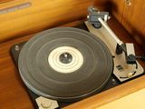 a record player that is sitting inside of a wooden box