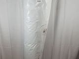 a white toilet sitting in a bathroom next to a shower curtain