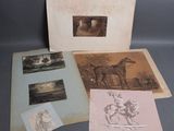 several old books with pictures of horses on them on a table