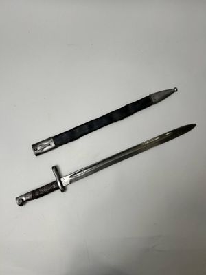 two knives that are laying next to each other on a table