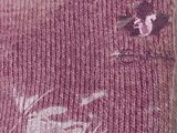 a purple sweater with a picture of a horse on it