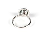 an image of a close up of a ring on a white surface