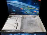 a box with a model of a star trek ship in it