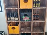 many bottles of beer on the shelves in the room