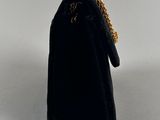 a black velvet purse with a gold chain hanging from it