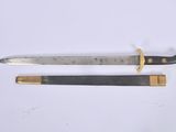 pair of old and worn swords on a white surface