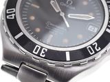 a close up of a watch on a white surface