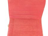 a red chair that is sitting on a white surface